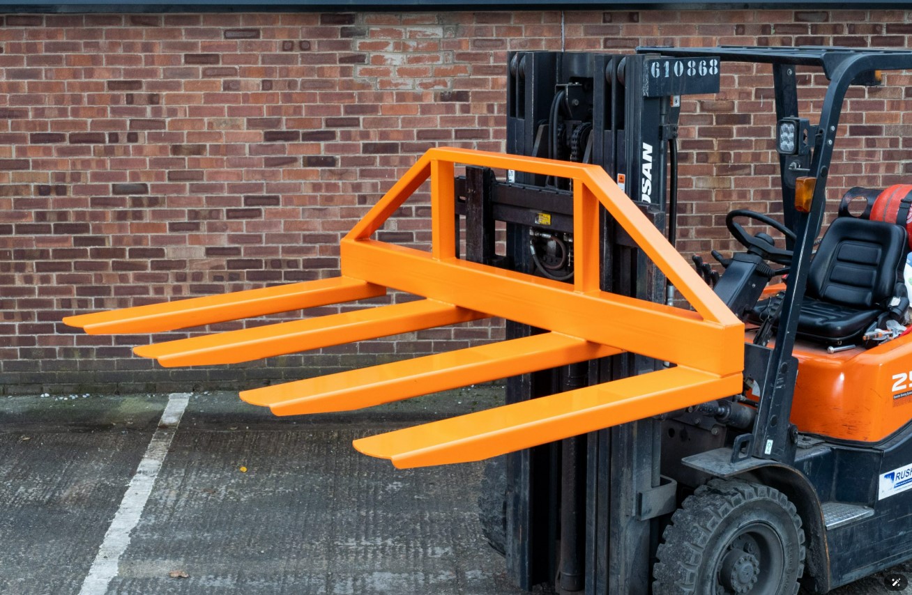 Forklift with fork extension attachment, ready for loading